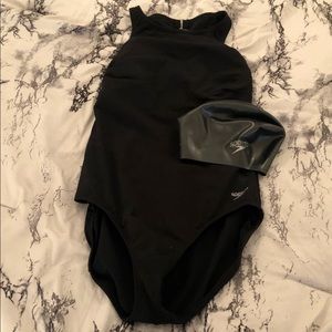 one piece swimsuit and cap
